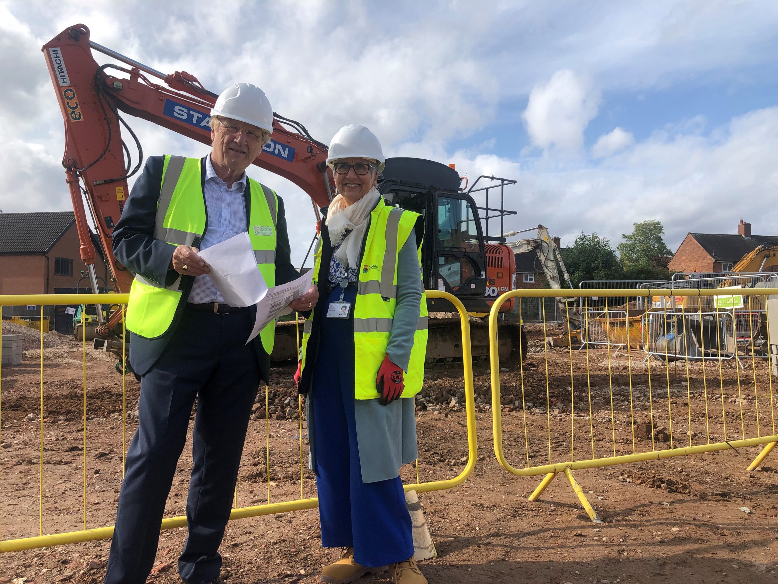 Cllr Ian Courts (Leader of Solihull Council) and Fiona Hughes (Chief Executive of Solihull Community Housing) at the Montfort site as building work begins.