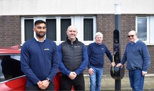 Left to right: Druvesh Desai Qwello (UK) Ltd; Simon Smith InstaVolt; Martin Hale Qwello (UK) Ltd; Cllr Andy Mackiewicz Solihull Council pictured in front of a Qwello charging unit