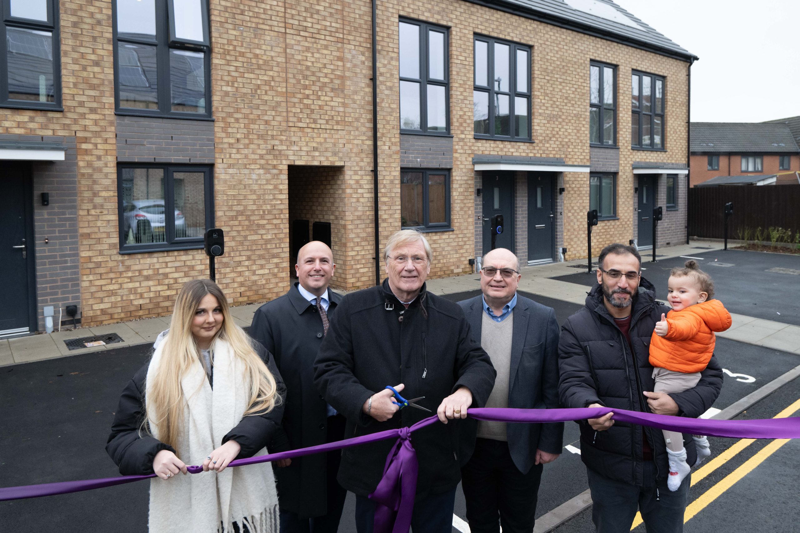 Cllr Mark Parker, Cllr Ian Courts and Cllr Andy Mackiewicz joined by Kinghurst residents outside the new Mountfort homes