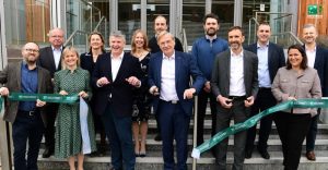 Jon Lander, Katie Trout, Stephen Hunt, Councillor Ian Courts, Pierre Bouchara, Julie Philps, Simon Robinson, Emma Norman, Hilary Smyth-Allen, Christophe Donnay, Chris Lawes, Ricardo Mantovani, Jason Wright all stood on some steps posing for a photo.