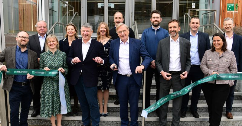 Jon Lander, Katie Trout, Stephen Hunt, Councillor Ian Courts, Pierre Bouchara, Julie Philps, Simon Robinson, Emma Norman, Hilary Smyth-Allen, Christophe Donnay, Chris Lawes, Ricardo Mantovani, Jason Wright all stood on some steps posing for a photo.