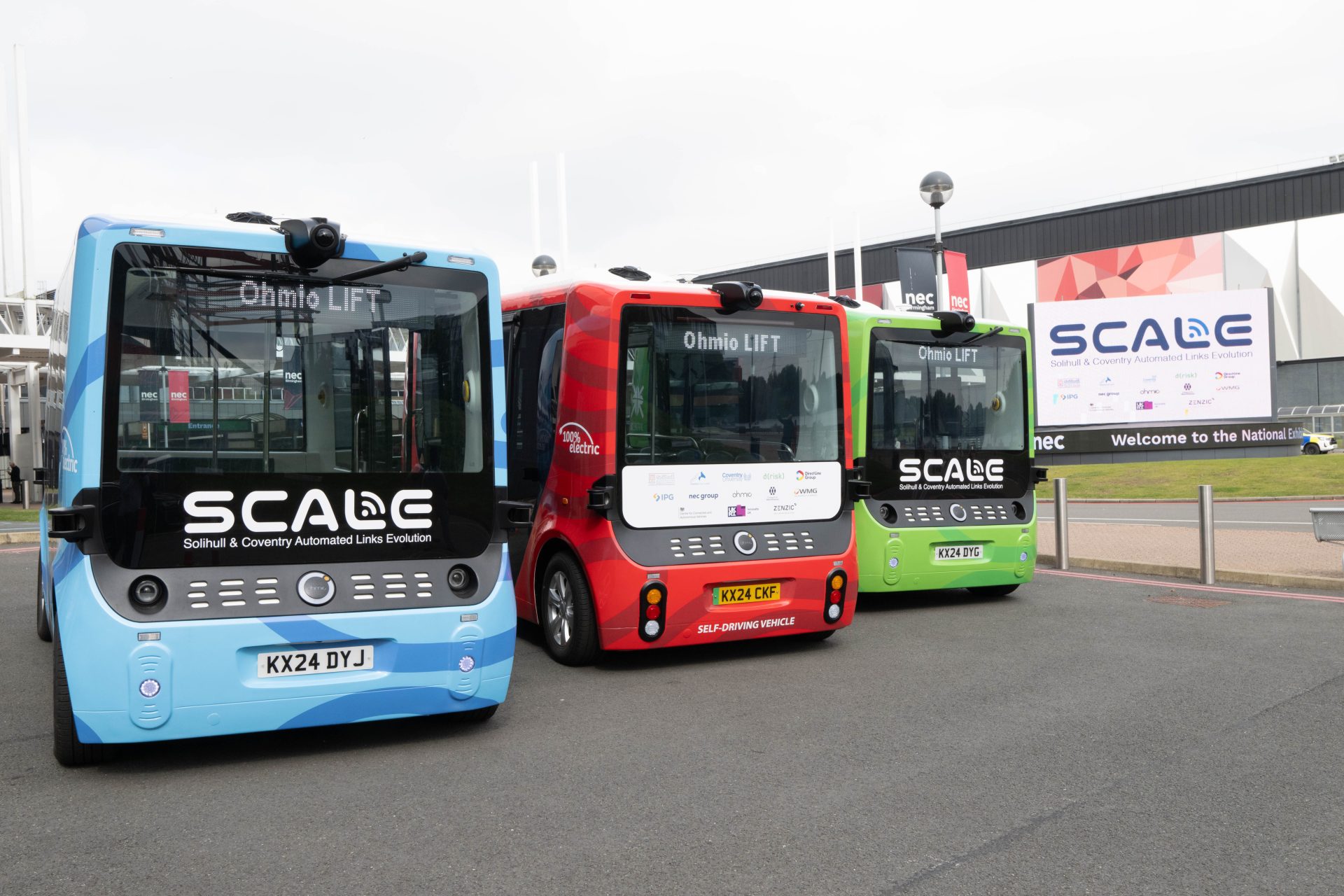 Photo showing the three autonomous shuttles being used for the SCALE pathfinder project