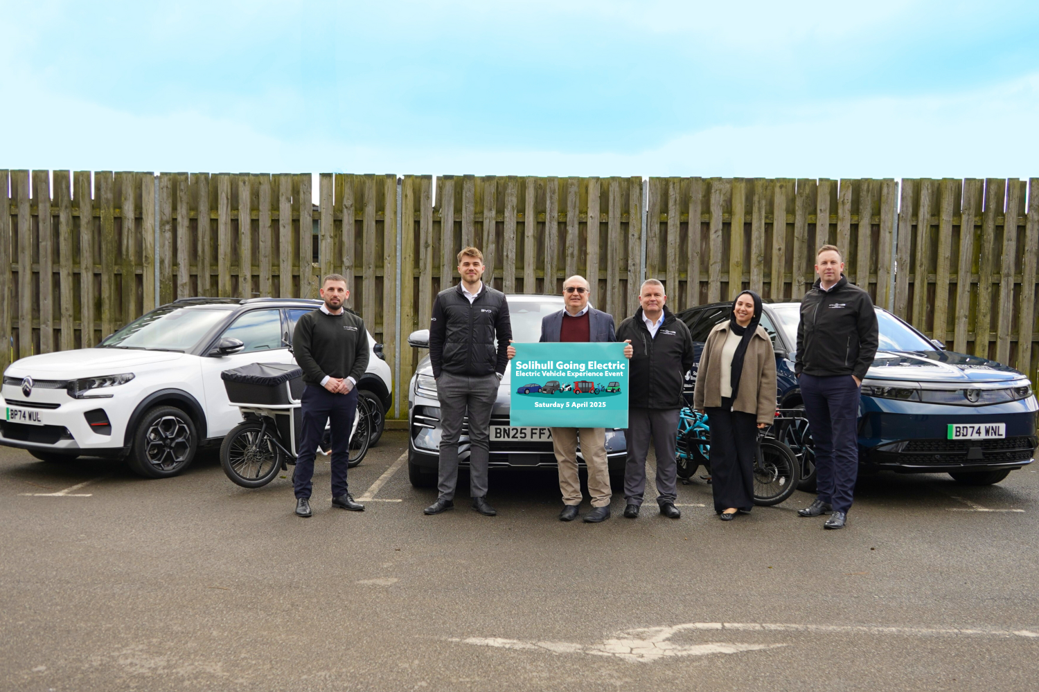 Cllr Mackiewicz with exhibitors from Citroën, BYD and Vauxhall